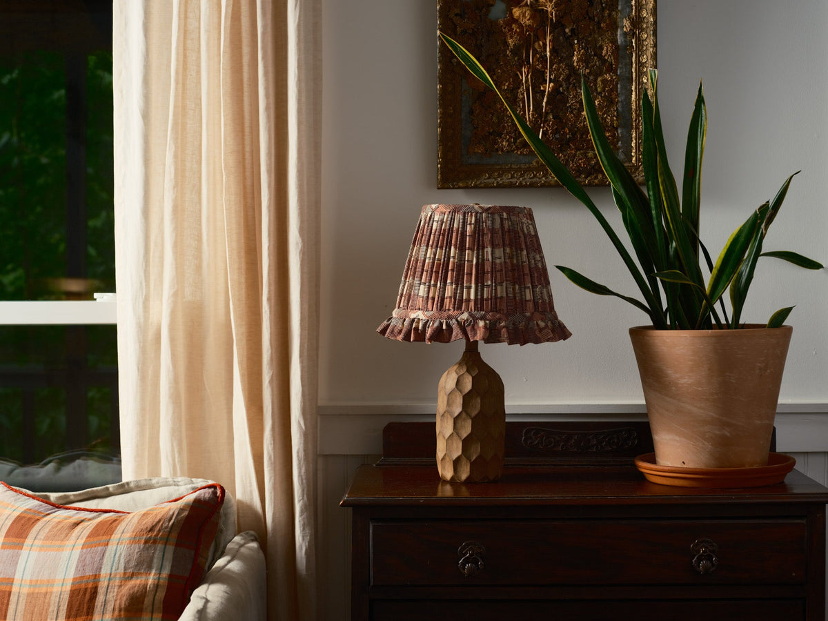 Cozy Living room corner with lamp and plant on a table 
