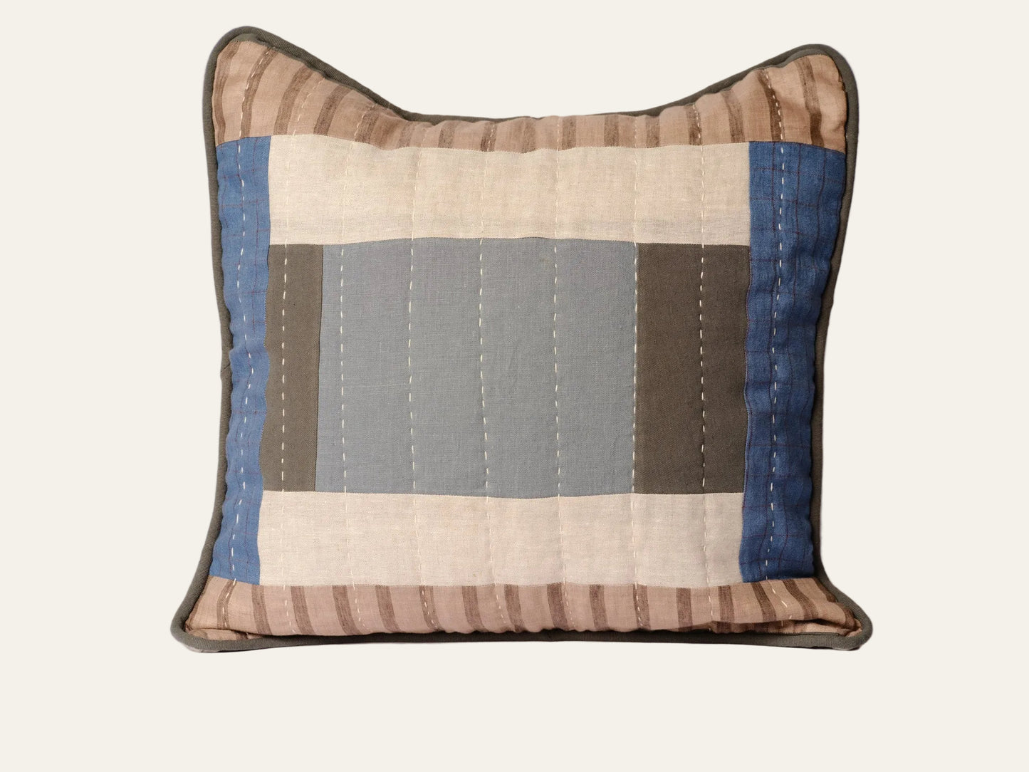 Patchwork pillow with striped pattern on a white background