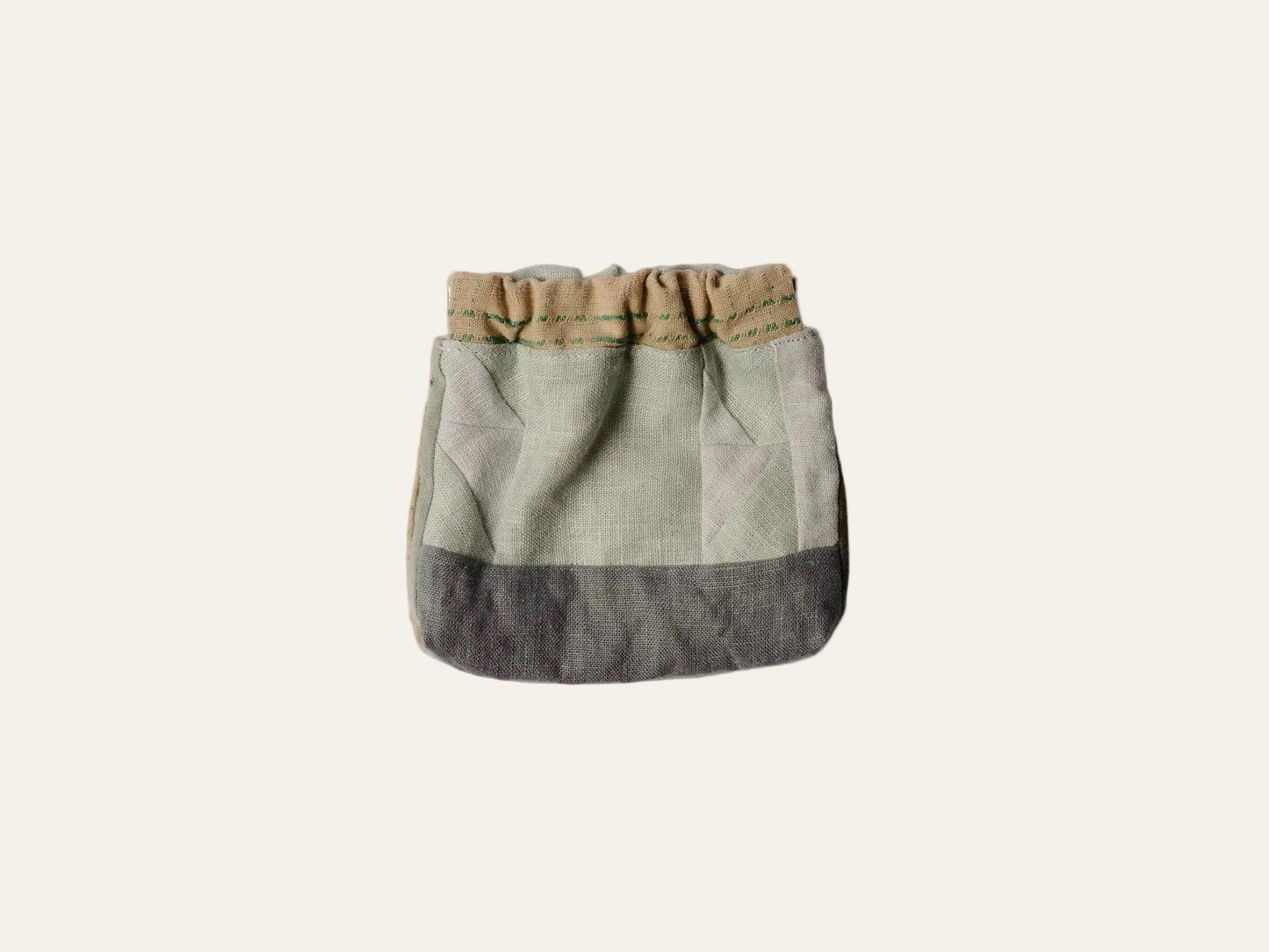 Two-toned fabric bag with a beige top and blue bottom on a white background