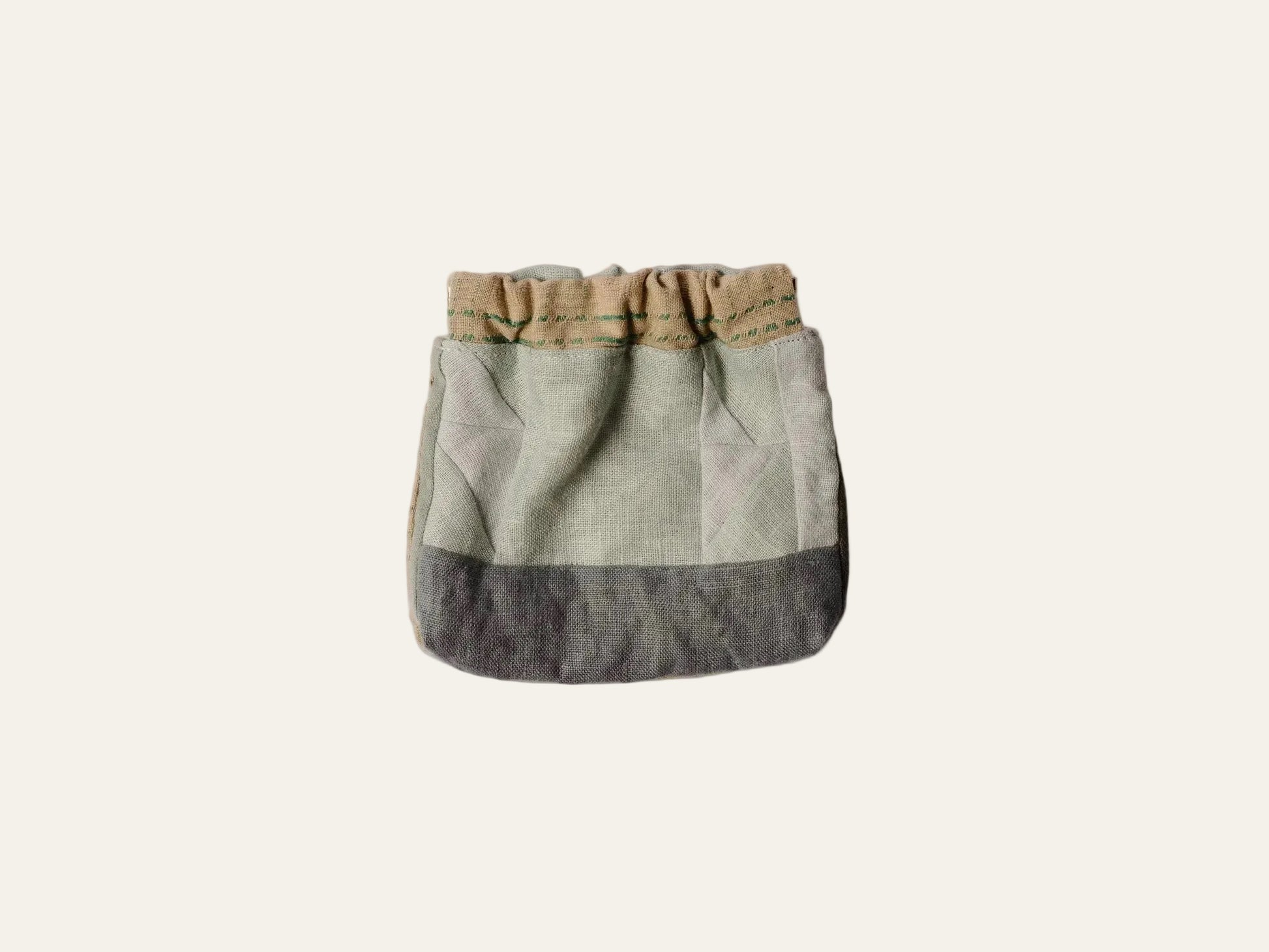 Two-toned fabric bag with a beige top and blue bottom on a white background