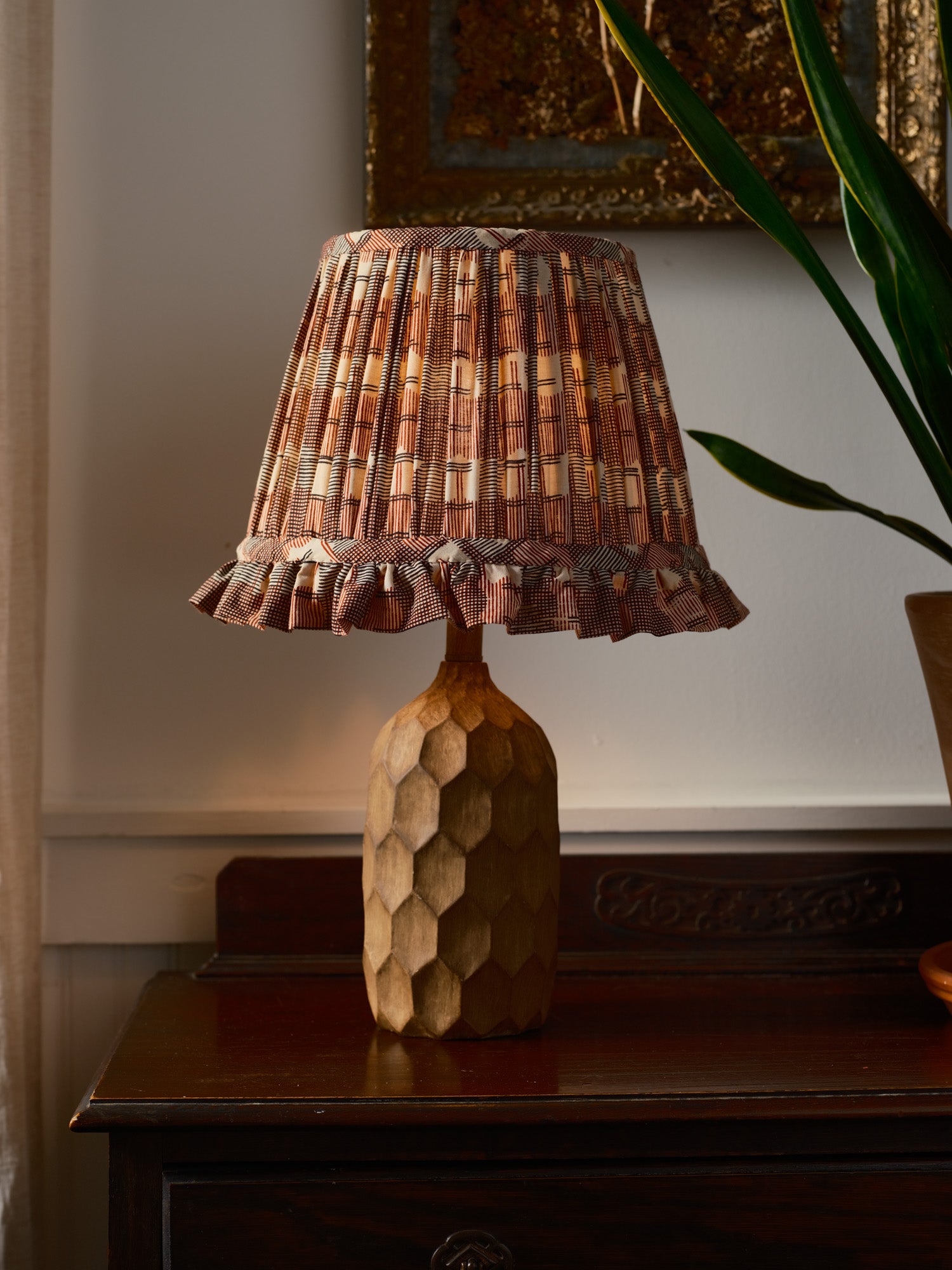  Lampshade made out of a red, cream and black block printed fabric. Gathered with a ruffle on bottom edge. 